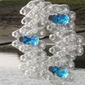 <i>Nestings</i>, 2011 Lorne Sculpture Prize. Recycled plastic, water, glass rocks, steel cable. Dimensions variable- 50mt span across bridge 
